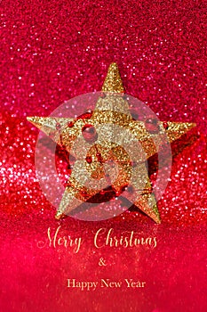 Golden Christmas or New year star on red glitter background