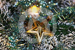 Golden christmas star to decorate home. Christmas background. Xmas ornaments