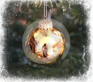 Golden Christmas tree ball framed in white