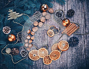 Golden Christmas Tree Decoration, Cinnamon Sticks, Dried Oranges, Baubles.