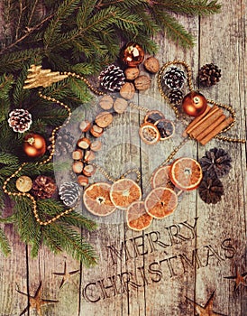 Golden Christmas Tree Decoration, Cinnamon Sticks, Dried Oranges, Baubles.