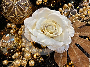 Golden christmas tree with elegant white rose