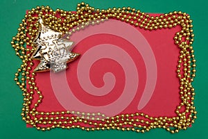 Golden christmas tree with frame of pearls on red and green background