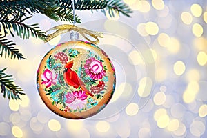 Golden Christmas Tree Scene Lights Background. Memorial ornament red cardinal