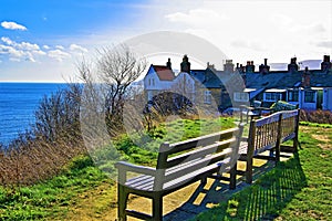 A Golden circle of chairs in Robin Hood`s Bay, North Yorkshire.