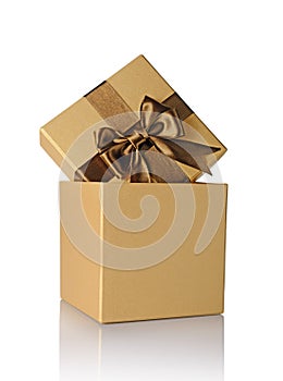 Golden classic shiny gift box with brown satin bow