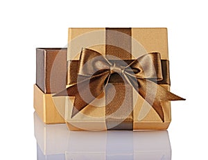 Golden classic shiny open gift box with brown satin bow