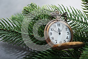 The golden clock, whose arrow are about twelve o`clock New Year celebration