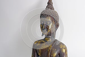 Golden closeup budda statue on white background