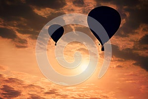 Golden cloudy sky with hot air balloons