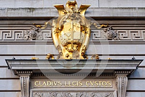 Golden coat of arms on the facade of Court of Justice of Paris, Paris photo