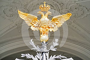 Golden coat of arms Russian double-headed eagle on the gates of the Hermitage