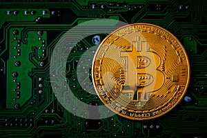 Golden coins with bitcoin symbol on green mainboard circuit background. Cryptocurrency, Money coin digital. Blockchain technology