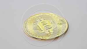 Golden coins with bitcoin symbol on a stack of coins isolated on white background. Bitcoin and cryptocurrency trading system.