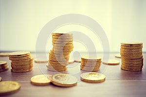 Golden coins concept on a wood table.Taxpayer business concept photo