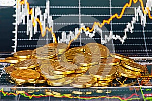 Golden coins and financial chart as background