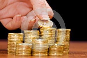 Golden coins on a wooden table