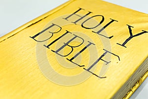 Golden color holy bible cover closeup detail view