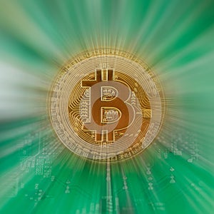 Golden color physical bitcoin crypto currency zoom against green circuit board