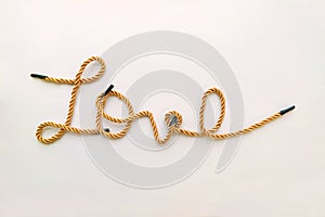 Golden color rope makes handwriting word of Love