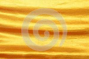 Golden color of wrinkle fabric cloth for background texture and design