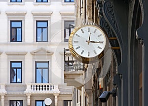 Golden Colored Clock in an Urban Context