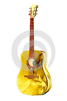 Golden colored shiny acoustic guitar with red strings, mahagony fretboard and picks isolated on the white background photo