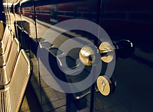 Golden coloured metallic door knobs with locks around a U Bahn stations