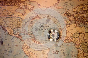 Golden Compass and the Map. Travel and Navigation Theme. Map used for background is in Public domain. Map source: Library of