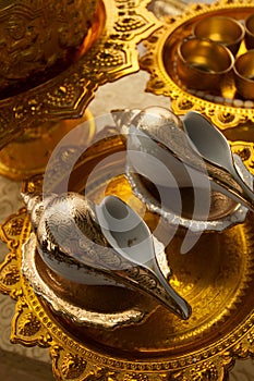 Golden conch shells for the blessing ceremony at a traditional Thai wedding