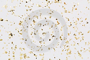 Golden confetti on white background Festive party or holiday glitter backdrop