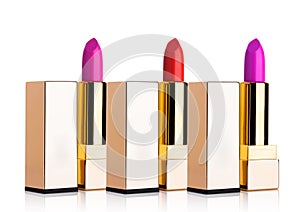 Golden containers of luxury cosmetic lipstick