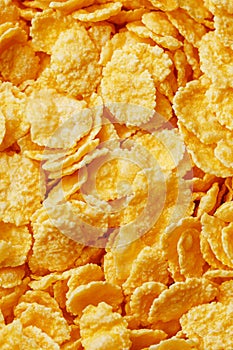 Golden cornflakes background and texture. View from above. cornflakes healthy breakfast. Close-up. macro