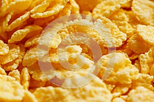 Golden cornflakes background and texture. View from above. cornflakes healthy breakfast. Close-up. macro