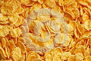 Golden cornflakes background and texture. View from above. cornflakes healthy breakfast. Close-up. macro