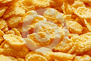 Golden cornflakes background and texture. View from above. cornflakes healthy breakfast, macro