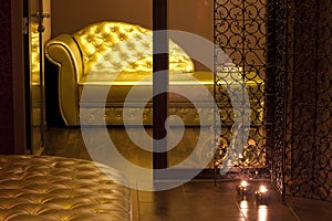 Golden couch in a SPA waiting area photo