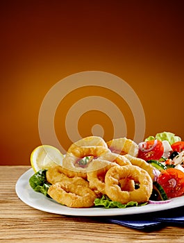 Golden crispy fried calamari or squid rings