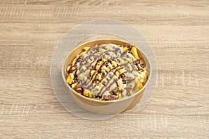 golden, crispy potatoes melt under a blanket of melted cheddar cheese and crispy smoked bacon bits