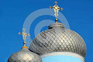 Golden crosses on metal dome roofs of an orthodox church, Ukraine