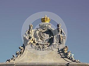 A golden crown on the stone sculpture.