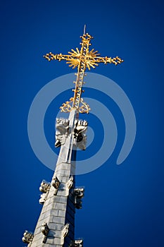 Golden Crucifix Atop Church Steeple