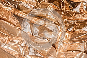 Golden crumpled foil texture