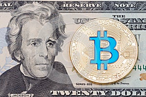 Golden cryptocurrency blue bitcoin on twenty dollar banknote bac