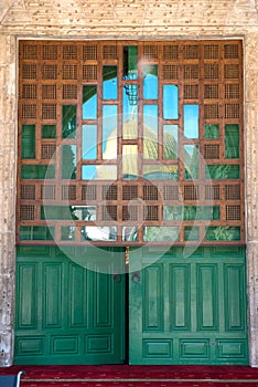 The golden cupola of Dome of the rock, reflecting in a window. Jerusalem, Israel