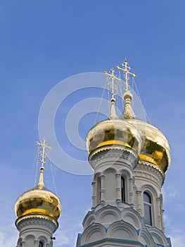 Golden cupolas of orthodox temple in spa city of Karlovy Vary, Czechia.