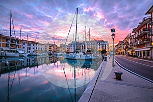 Golden dawn in town of Grado harbor photo