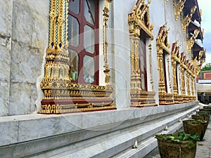 Golden decorated Window in Temple of Bells, Bangkok photo