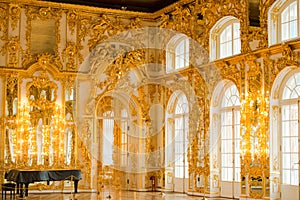 Golden decoration in ballroom of roccoco palace Catherine Palace,  located in the town of Tsarskoye Selo or Pushkin St. Petersburg