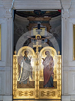 Golden decorative door inside catholic church in Italy